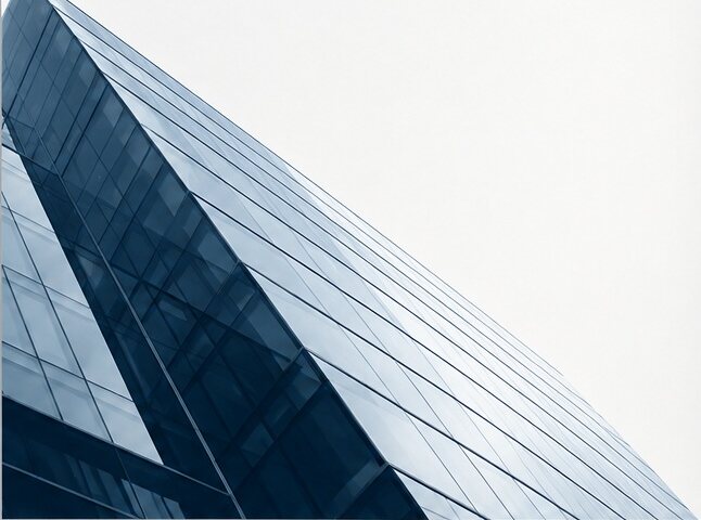 Glass office tower rising at an angle